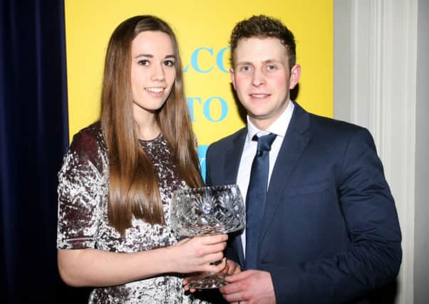 Andrew Barr, of sponsors Flamingo Health and Fitness, presents the Junior Sportsperson award to Roseanna McGuckian. INBT06-216AC