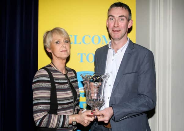 Con Magee's GAC Chairman Seamus McMullan receives the Participation award from Eunice Campbell of sponsors Diamond Recruitment. INBT06-219AC