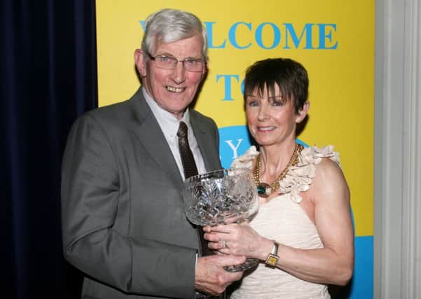 Francis Scullion of sponsors Ballymena Credit Union presents the Adult Sportsperson award to Sharon Magee. INBT06-222AC