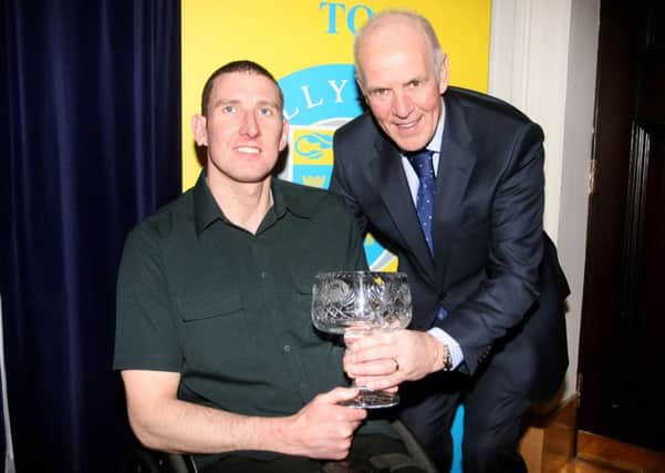 Darrell Erwin receives the Sportsperson with a Disability award from John Blair of sponsors JBE Building Services. INBT06-223AC