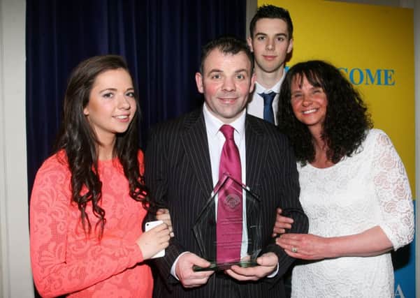 Eamonn Loughran who was inducted into the Ballymena Sporting Hall of Fame, pictured with wife Angela, son Caolan and daughter Alicia. INBT06-227AC