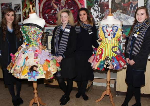Art students Gabrielle Lennon, Kate Flanagan, Justyna Gosch and Shannon McLernon with some of the A Level Art exhibitions on display at Open Night.