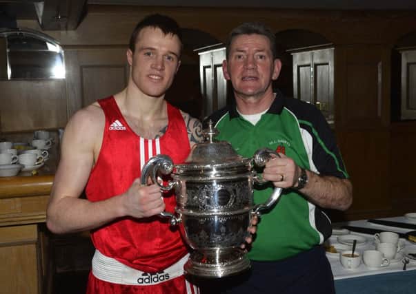 Steven Donnelly celebrates his fifth Ulster senior title success with his All Saints ABC coach Gerry Hamill
. Picture: Press Eye.