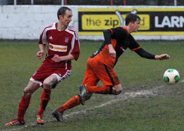 Carrick Rangers' Daniel Kelly in Saturday's 3-1 win against Dergview at a wet and windy Inver Park. INCT 06-024-PSB