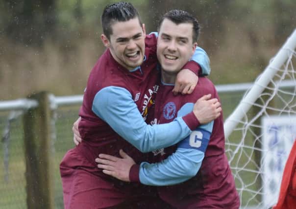Newbuildings United winger Steven Wallace celebrates with team skipper Graham Moore after scoring against Coleraine Reserves on Saturday. INLS0514-135KM