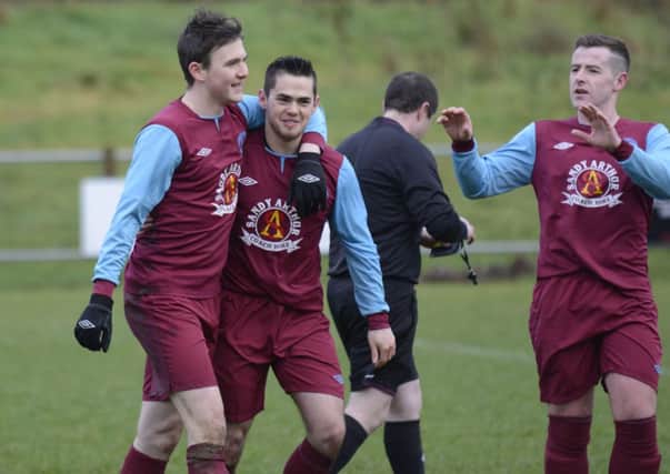 Newbuildings United striker Ricky Lee Dougherty, winger Steven Wallace and David Scanlon celebrate after one of their goals against Coleraine Reserves on Saturday. INLS0514-139KM