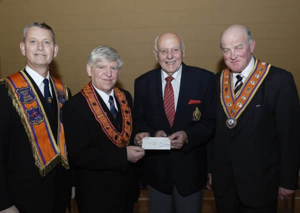 James Hetherington, second from left, City Grand Master, City of Londonderry Grand Orange Lodge, pictured handing over a donation of £400.00 to Jack Glenn, Trustee for Parkinsons UK. Included are Edward Stevenson, right, Grand Master of the Grand Orange Lodge of Ireland, and Alderman Maurice Devenney, Deputy City Grand Master. INLS0514-164KM