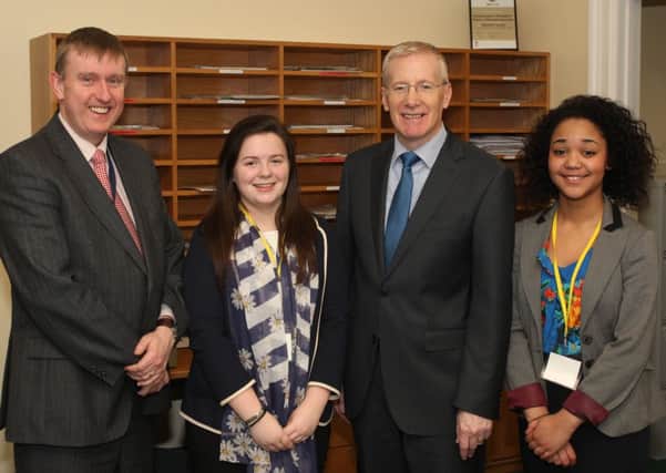 Ballymoney High School pupil Claire McVicker and Kiera Olulunmi from Coleraine High School pictured with North Antrim Assembly Member Mervyn Storey and MLA Gregory Campbell. INBM07-14 High Students