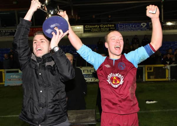Newbuildings United captain Wesley Ferguson and club captain Peter Blair (right), hold-up the North West Senior Cup after their team defeated Institute in a penalty shoot-out at the Riverside Stadium. INLS4513-507MT