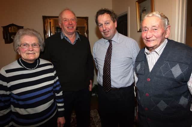 Danny Kinahan MLA (second from right) with Boghill Road residents James (92) and Nan (80) Montgomery and their son, Ian.