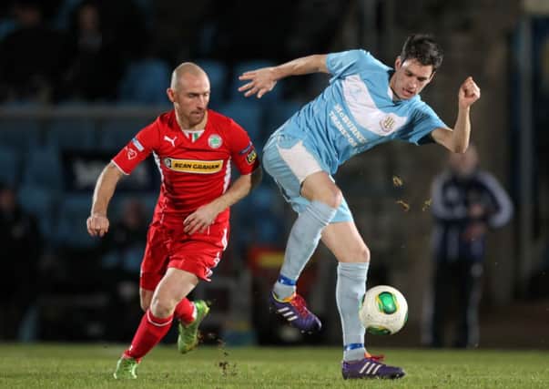 Ballymena's Mark Surgenor controls the ball under pressure from Cliftonville's Barry Johnston during tonight's Danske Bank Premiership match at the Showgrounds. Picture: Press Eye.