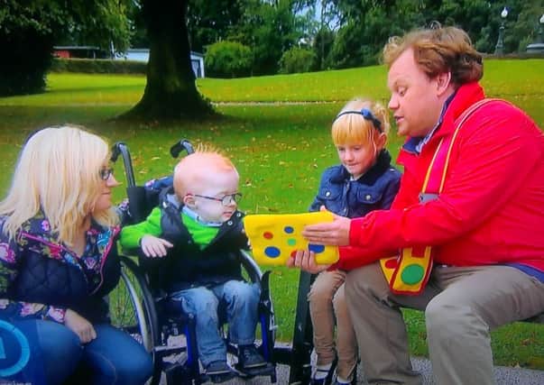 Abi joins Blake to look at Mr Tumble's spotty bag.