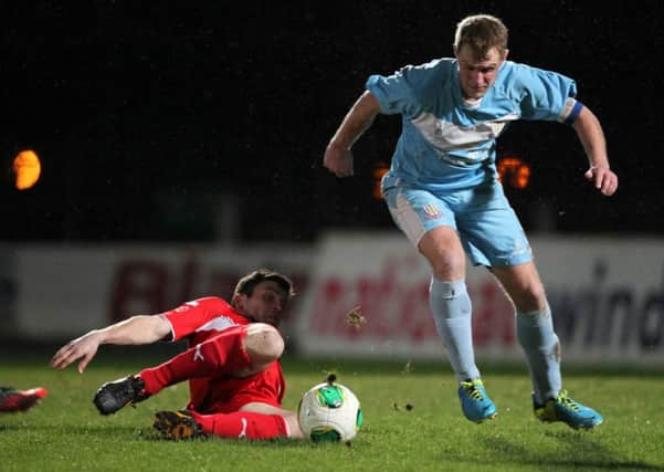 Ballymena's Johnny Taylor with Cliftonville's Diarmuid O'Carroll during Tuesday night's match at the Showgrounds. Picture: Press Eye.