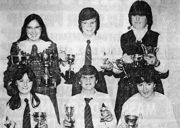 1983 - Trophy winners display their awards at the Ballymena Girls' High School prize giving. Back row from left: D. Jamieson, M. Mills and H. Ramsey. Front row from left: S. Booth, T. McCready and D. McIlhagga. INBT06-759F