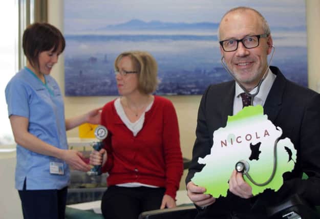 Pictured are Professor Ian Young, Principal Investigator of the NICOLA Project with Sarah Cuddy, NICOLA Nurse and a participant undergoing a health assessment. INBM07-14