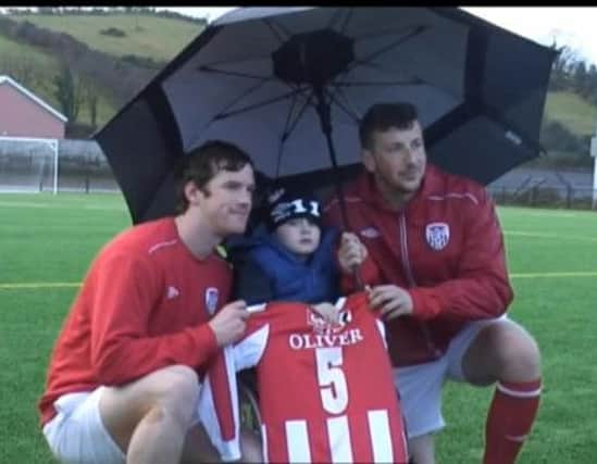 Five year old Oliver Dickey meets his Derry City team mates