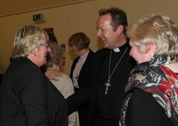 Minister of Gracehill Moravian Church Sarah Groves (left) and joint chairperson of the Ballymena Church Members Forum Wendy Morgan chat with Arch Bishop Eamon Martin at last week's meeting in Gracehill. INBT 07-109JC