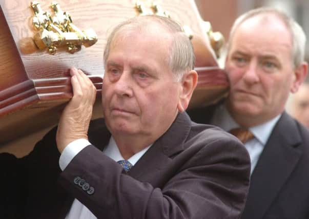 Mark Durkan and Joe Hendron carrying the coffin of Sarah Conlon in 2008. Her husband, Giuseppe, and son, Gerry, were wrongfully convicted of the Guildford pub bombings.
