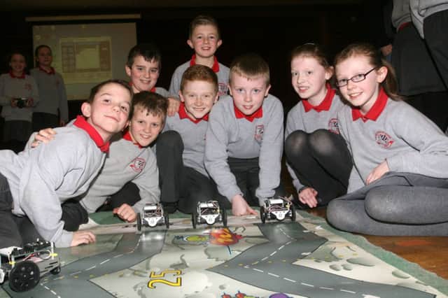 Pupils from Carniny PS taking part in the SENTINUS Robotics day at Dunclug College. INBT07-219AC