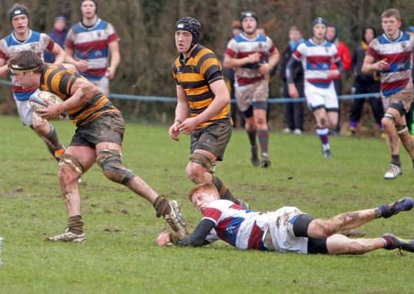 FLAT OUT. An RBAI player escapes the challenge of a Dalriada player during the Belfast side's cup win on Saturday.INBM7-14 034SC.