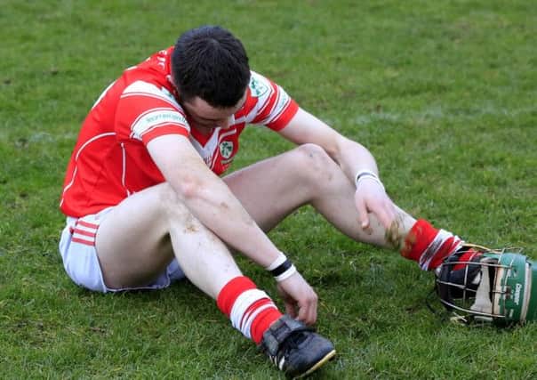 Devastation for Loughgiel at the final whistle as goal scorer Benny McCarry slumps to the ground.
 Picture: John McIlwaine - ©INPHO/Presseye