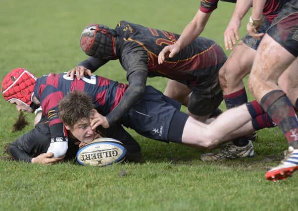 Foyle's Patrick Leeson grounds the ball to score a try against Belfast Royal Academy on Saturday. INLS0614-148KM