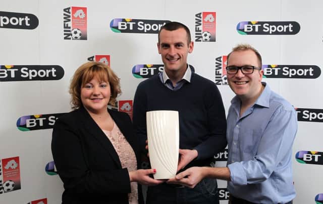 Marie McMullan (Head of Consumer Sales BT Sport NI), presents Oran Kearney with the 

BT Sport Manager of the Month award for January, also pictured is Paul Ferguson, Chairman NIFWA.