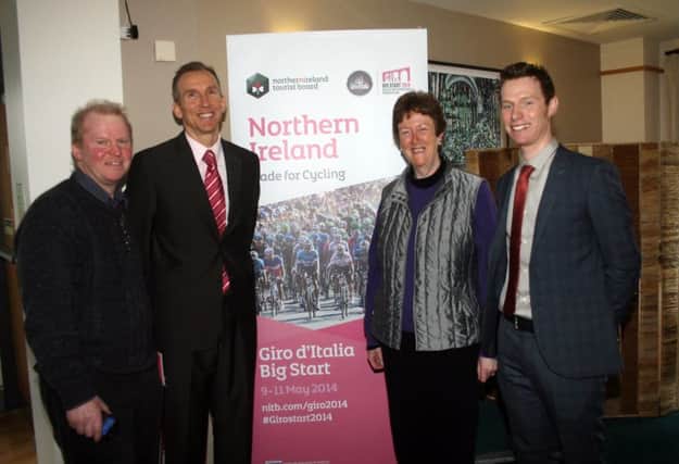 Cyclists John Madden and Stephen Gallagher join local councillors Tom McKeown and Joan Baird at the roadshow to promote the Giro d'Italia in Ballycastle Golf Club.INBM07-14 141F.