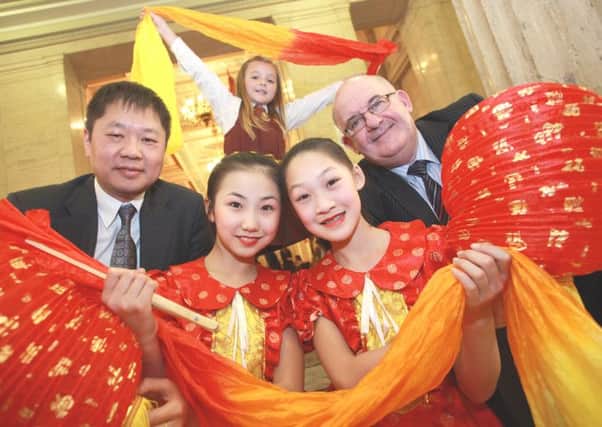 Pictured at a special event in Parliament Buildings to mark the Chinese New Year last Tuesday are front row, from left, Minister Counsellor Mr Xiang Xiaowei, Cultural Minister, Chinese Embassy; Chen Nuo and Kong Zihan from the Little Red Flower Dancing Troupe, who travelled from China as part of the celebrations. Back row: Ellis Harte from Millburn Primary School, Coleraine. INCR07-105S