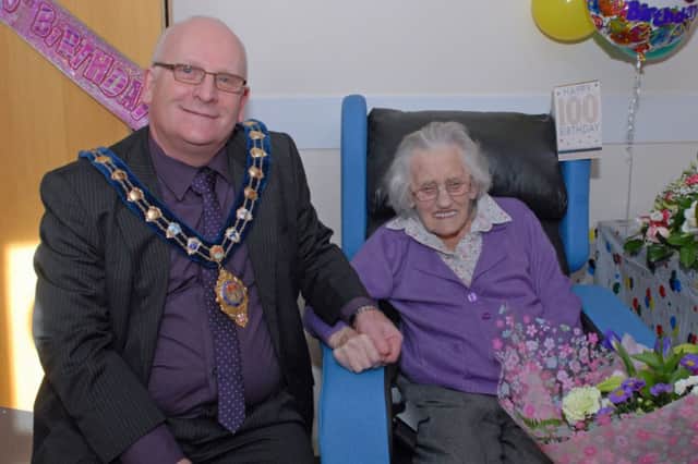 Mayor of Carrickfergus Alderman Billy Ashe is pictured with Mrs Laura Clarke who celebrated her 100th birthday with family and friends in Tamlaght Nursing Home. INCT 07-002-PSB