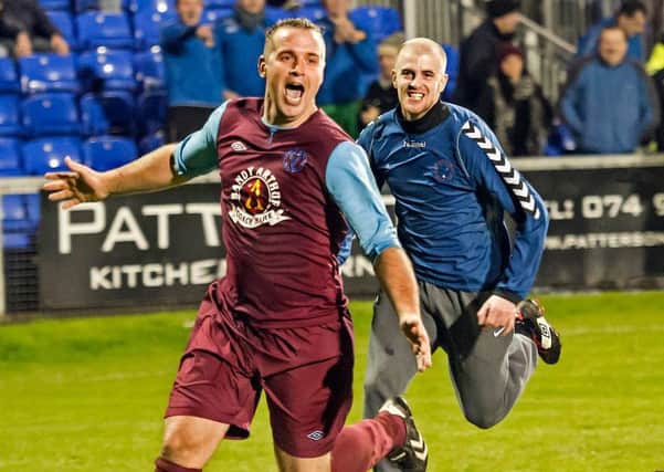 A jubilant Gregory McIvor runs away celebrating after his winning spot-kick ensured Newbuildings United defeated Institute, in the North West Senior Cup Final.