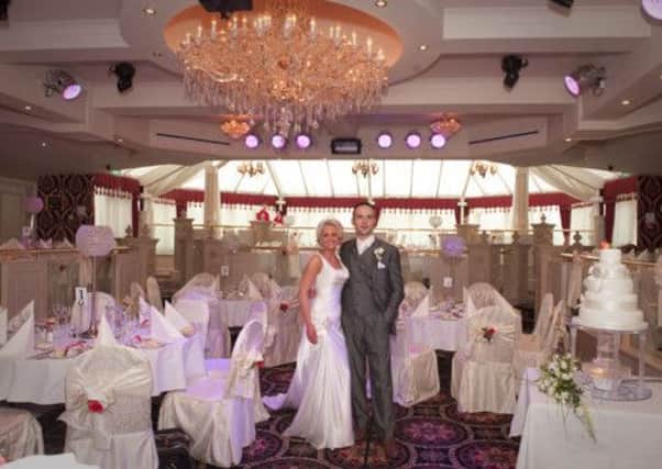 A bride and groom in the Belfray Ballroom.