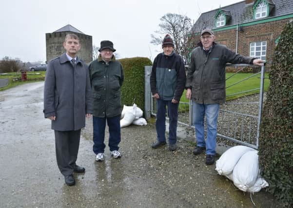 Alderman Maurice Devenney, left, pictured with Culmore Point residents, from left, Leonard Gough, Matt Stewart and John Clarke. INLS0614-194KM