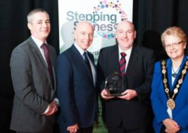 Alderman William Leathem after receiving his surprise Fundraising Champion award, with Richard Knox (Chair of Stepping Stones Board), John Daly (host) and Mayoress of Lisburn, Margaret Tolerton.
