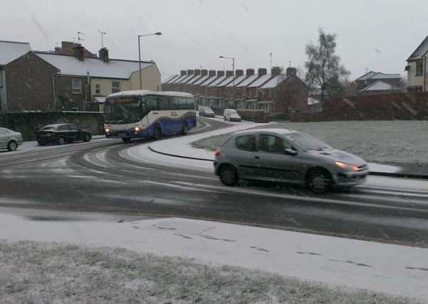 Vehicles on Duncreggan Road during snow showers. (1102MM20)