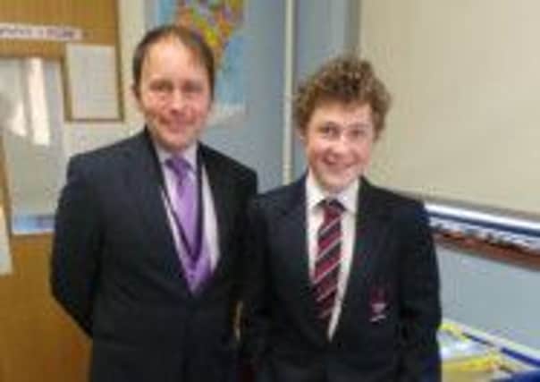 The Met Office's public weather advisor for Northern Ireland, John Wylie, pictured with Larne Grammar School pupil Jonny Topping.  INLT 07-687-CON