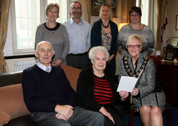 Andrew and Margaret Hanna, who celebrated their 60th Wedding Anniversary in February 10, are pictured  with the Mayor of Ballymena, Cllr. Audrey Wales, at special reception in The Braid to honour the occasion. Included are Andrew and Margaret's son and daughters Elizabeth Nesbitt, David Hanna, Angela Waide and Linda Kerr. INBT08-212AC