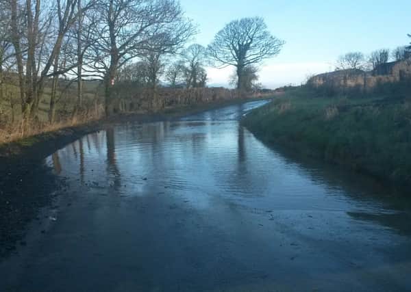 Flooding has replaced the snow in many low-lying areas of the Londonderry district,including Tullyally Road.