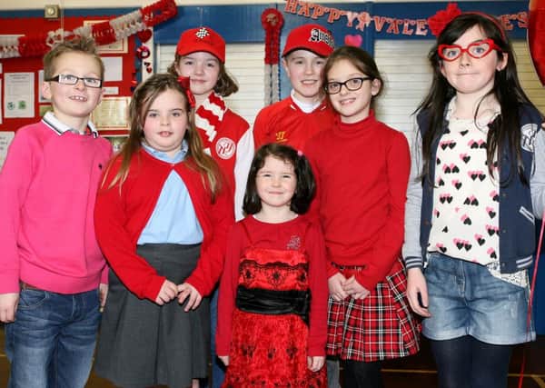 The pupils of Groggan PS wearing red and pink to raise money for the British Heart Foundation's  "Ramp up the Red" campaign. INBT08-223AC