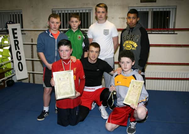 All Saints Boxers Oran Ward, Sam McCullough, Frank Duffin, Lewis McKee, Ronan Tierney, Emekaonw Uka, who had great success at the recent Antrim Championships, pictured with club members Steven Donnelly. INBT08-214AC