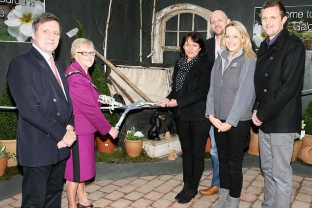 Mayor of Ballymena, Cllr. Audrey Wales, cuts a ribbon to officially open Creative Gardens at Galgorm. Included are Christopher Brook from Galgorm Castle, and Diana Gass, Philip Gass, Jenny Dumigan and Oliver Gass all from Creative Gardens. INBT08-227AC