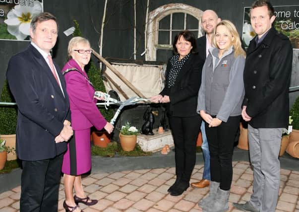 Mayor of Ballymena, Cllr. Audrey Wales, cuts a ribbon to officially open Creative Gardens at Galgorm. Included are Christopher Brook from Galgorm Castle, and Diana Gass, Philip Gass, Jenny Dumigan and Oliver Gass all from Creative Gardens. INBT08-227AC