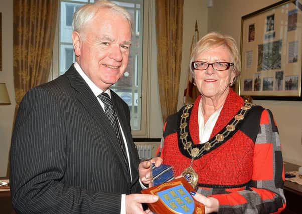 Ballymena Mayor Audrey Wales presents a Ballymena Seven Towers plaque and council tie to Gracehill PS principal Mr. Lexie Scott. Mr. Scott will be part of a delegation of head teachers traveling to Brazil on an Improving Literacy Educational trip and will present the gifts to the Brazilian Educational representatives.  INBT 08-810H