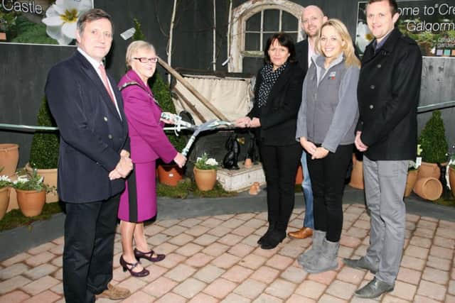 Mayor of Ballymena, Cllr. Audrey Wales, cuts a ribbon to officially open Creative Gardens at Galgorm. Included are Christopher Brook from Galgorm Castle, and Diana Gass, Philip Gass, Jenny Dumigan and Oliver Gass all from Creative Gardens. INBT08-227AC
