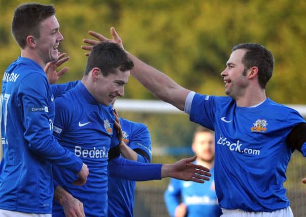 Glenavon's Andrew McGrory
celebrates after scoring to make it 1-1
during the Mid-Ulster derby at Mourneview Park, Lurgan