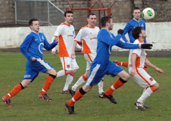 Action from Carrick Rangers and Loughgall at Inver Park. Photo: Phillip Byrne