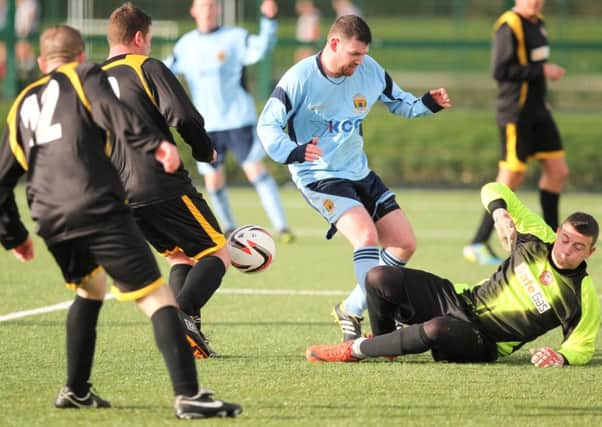 Forthriver's Michael McFarland is thwarted by the Glengormley 'keeper.