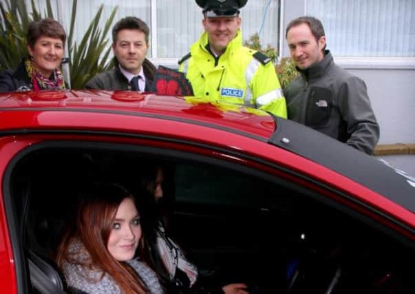 Pictured with students at the Valentines Day Car Crash Simulator project at North West Regional College  Limavady Campus -  are (from left to right) campus manager Norah Canny, Limavady PCSP chair, Councillor Alan Robinson, PSNI road policing education officer, Constable Sydney Henry and Limavady PCSP Officer Andy Chapman.