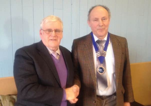 Herbie Boyd congratulates Alan  Darragh following his election as NIPA President.