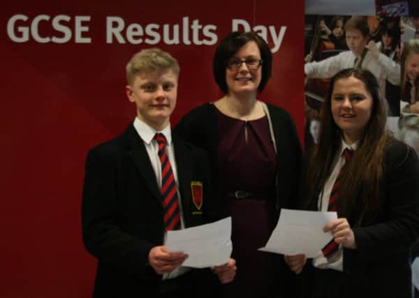 Year 12 pupils at Ballyclare High School, Mark Crowe from Greenisland and Erin Christie from Ballyclare, who received their results at the dedicated mock results day. They are pictured with Helen Graham, head of Year 12 and Maths teacher at the school.